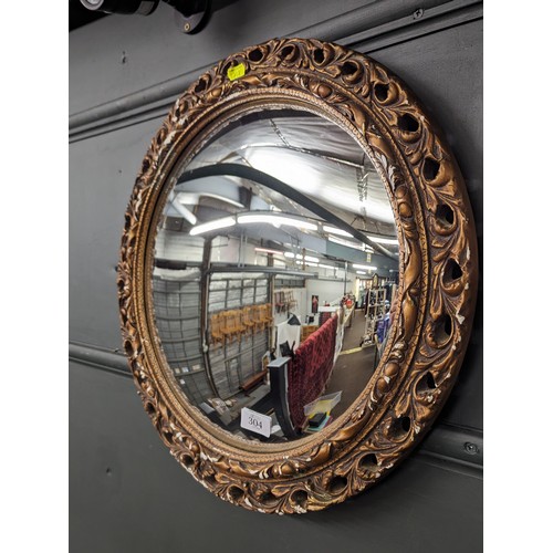 304 - Circular convex mirror in gilt frame, some losses to frame, dia. 51cm