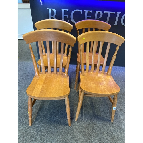 571 - Set of four modern beech chairs.