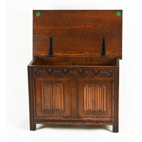 558 - Small oak hall chest, with lift top and carved frieze with inset panels. W69cm D38cm H51cm