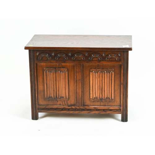 558 - Small oak hall chest, with lift top and carved frieze with inset panels. W69cm D38cm H51cm