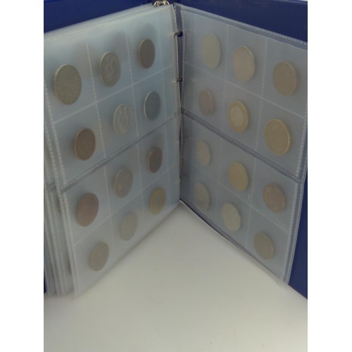 384 - Blue coin album containing mixed world coins, gross weight including album 1.53kg