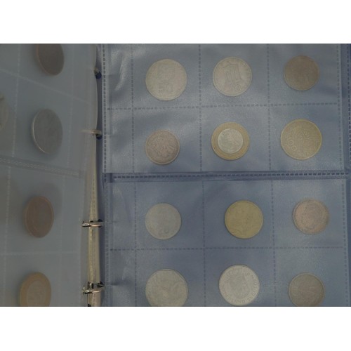 384 - Blue coin album containing mixed world coins, gross weight including album 1.53kg