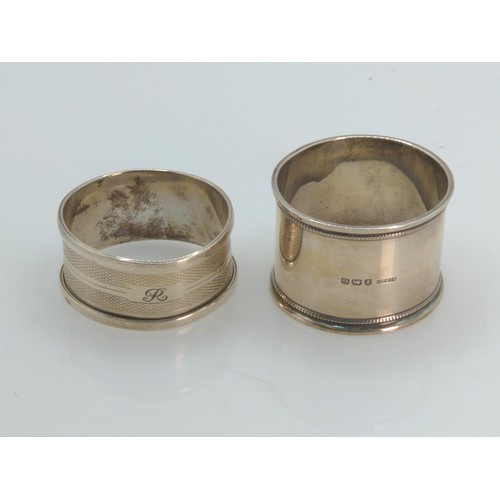 397 - Two silver napkin rings, various maker's and dates, one initialled, gross weight 26.3 grams