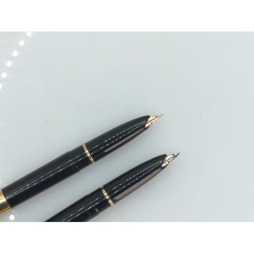 405 - Two Sheaffer's fountain pens with gold coloured lids