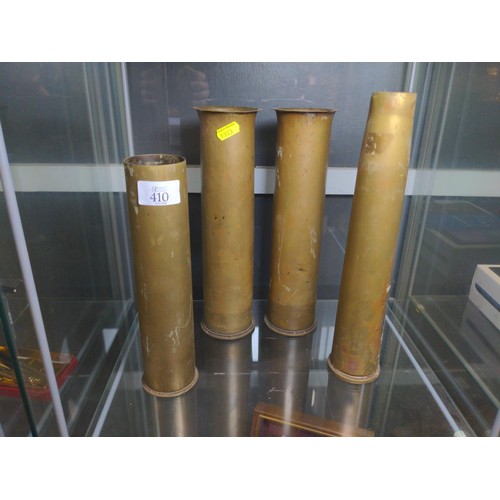 410 - Four military brass shells, including a pair of 'trench art' vases, height of pair 28.8cm