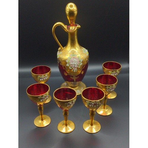 457D - Venetian ruby glass & gilt decanter and 6 liqueur glasses with applied floral detail