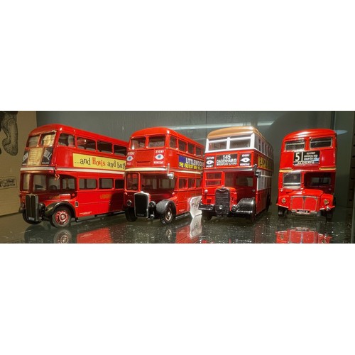 446 - Two Corgi and two Solido die-cast double decker buses.