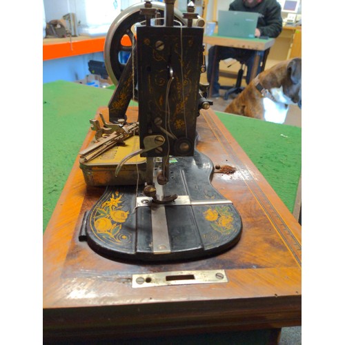 156 - Vintage sewing machine in walnut inlaid case with mother of pearl to section of body