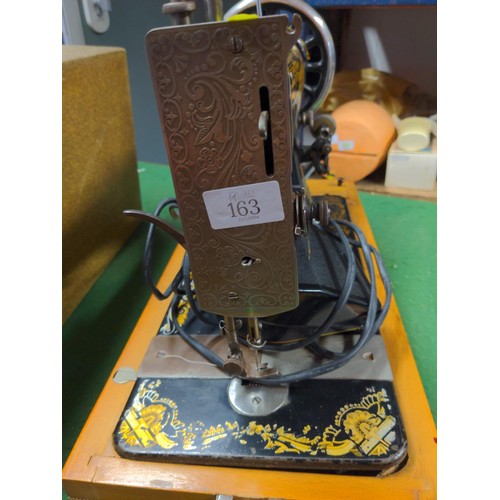 163 - Singer electric sewing machine in case 