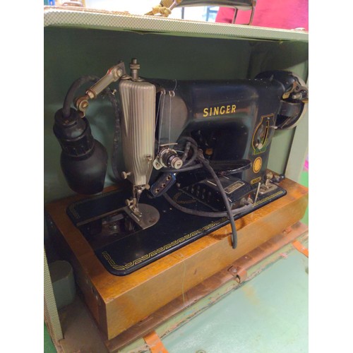 165 - Electric Singer sewing machine in case 