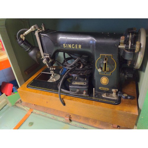 165 - Electric Singer sewing machine in case 