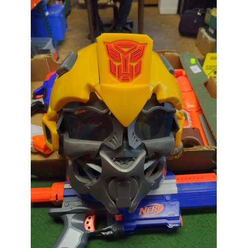 195 - Box of toys Inc Bumble bee helmet and nerf guns 