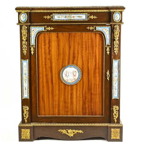 An ormolu and Sevres style porcelain mounted cabinet. With top ormolu banded top frieze with inset porcelain panel, and rectangular single door, with key, mounted with central cherub decorated porcelain plaque (af), sat on outset plinth base. W89cm D38cm H114cm