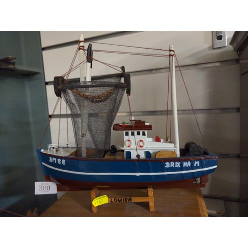 300 - Wooden model fishing boat. 29cm long.