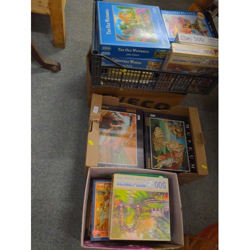 705 - Large quantity of jigsaw puzzles over four boxes