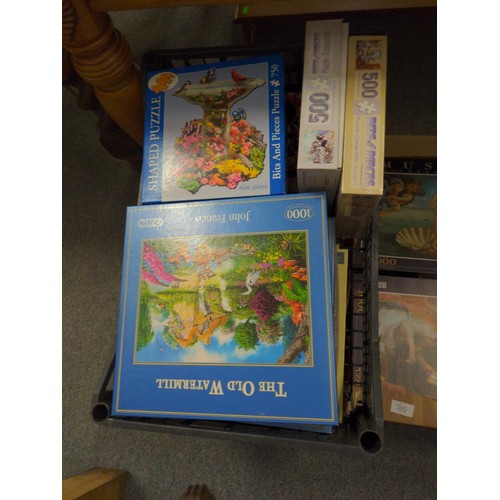 705 - Large quantity of jigsaw puzzles over four boxes