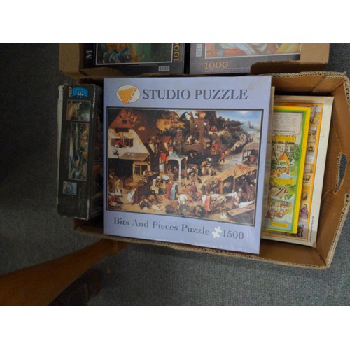 705 - Large quantity of jigsaw puzzles over four boxes