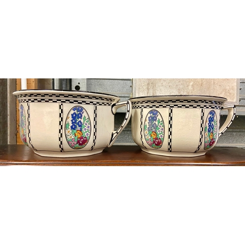 709 - Two Royal Doulton chamber pots with floral decoration.