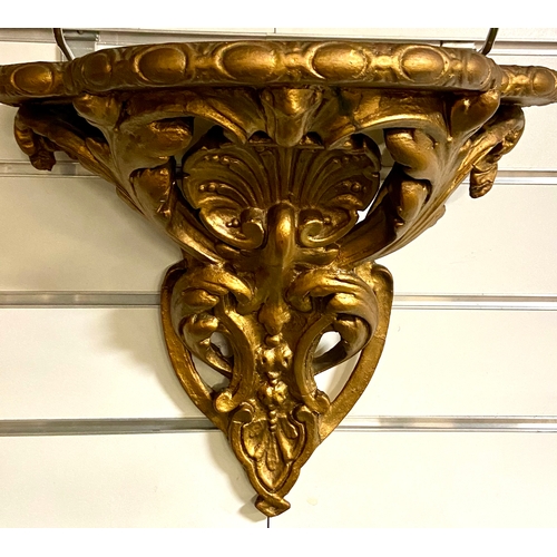 444 - Two ornate and gilded wall brackets/ shelves. W38 H32 cm