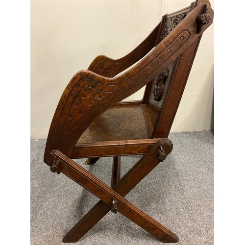 384 - C19 ak carved oak and walnut Glastonbury chair with  cross legs and centre turned stretcher. W65 D44... 