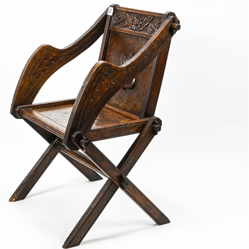 384 - C19 ak carved oak and walnut Glastonbury chair with  cross legs and centre turned stretcher. W65 D44... 