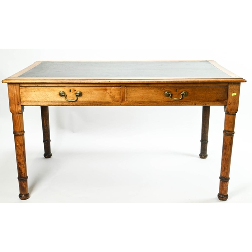 388 - Large MOD style golden oak leather tropped writing table, with 2 drop handle fronted drawers. W186cm... 