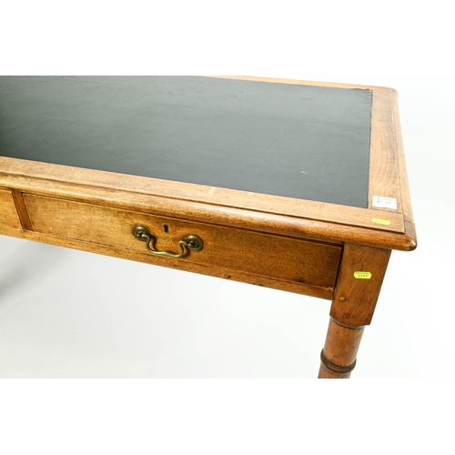 388 - Large MOD style golden oak leather tropped writing table, with 2 drop handle fronted drawers. W186cm... 