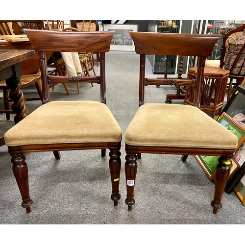 361 - Two mahogany upholstered dining chairs with turned legs.