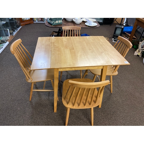 568 - Modern beech table with two small folding leaves and four Ercol style chairs. Table W97 D77 H74cm