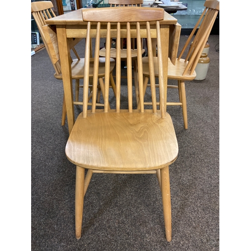 568 - Modern beech table with two small folding leaves and four Ercol style chairs. Table W97 D77 H74cm