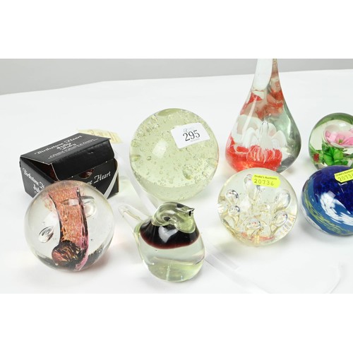 295 - Ten assorted glass paperweights