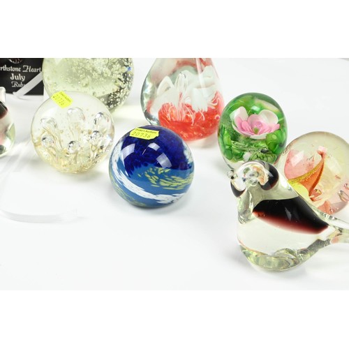 295 - Ten assorted glass paperweights