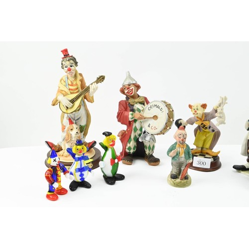 300 - Collection of assorted clowns inc. glass, ceramic etc. Height of tallest 25cm