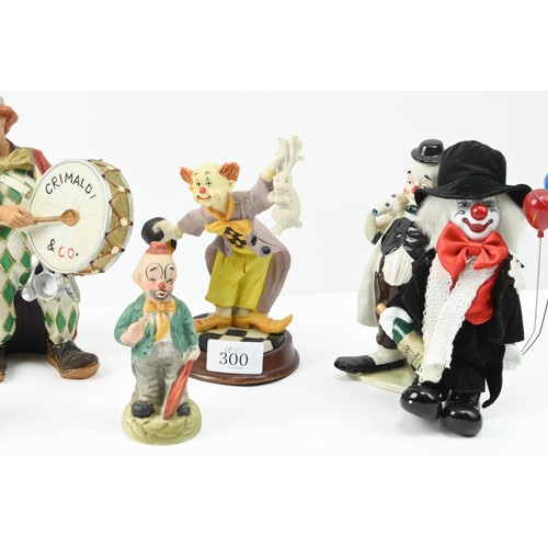 300 - Collection of assorted clowns inc. glass, ceramic etc. Height of tallest 25cm