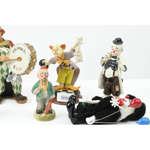 300 - Collection of assorted clowns inc. glass, ceramic etc. Height of tallest 25cm