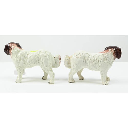 303 - Pair of Staffordshire pottery St Bernard dogs, circa 1890, painted in russet and brown, height 13cm