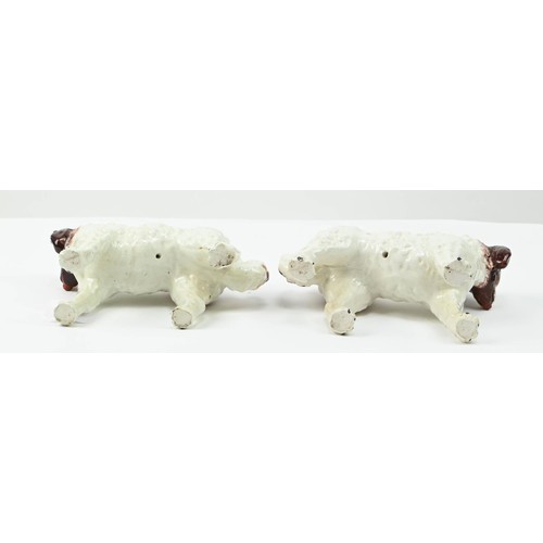 303 - Pair of Staffordshire pottery St Bernard dogs, circa 1890, painted in russet and brown, height 13cm