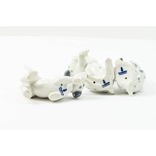 304 - Three Lladro Dalmatian puppies, tallest 9cm