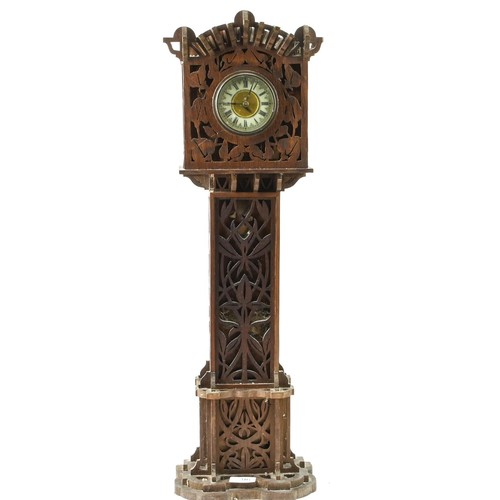 316 - Tall wooden fretwork clock with enamelled face surrounded in brass, height 70cm x W19cm, some losses