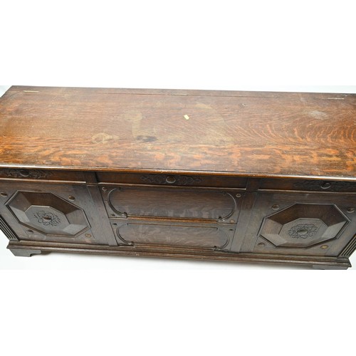 354 - Large panel fronted coffer. W152cm D50cm H61cm