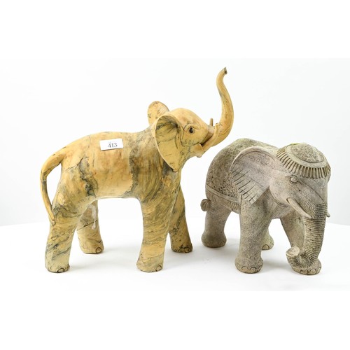 413 - Two decorative elephants. Tallest to trunk 36cm.