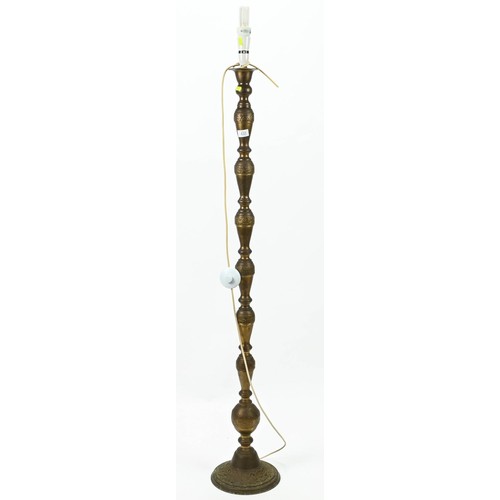 432 - Brass standard lamp base with Asian design. Height to fitting 140cm