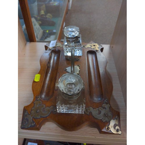 514 - Desk writing set with two glass ink wells and pen holders, brass detail on rosewood base.