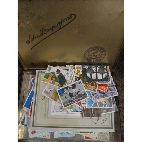 557 - Two boxes of mixed stamps, loose and albums of world stamps. 