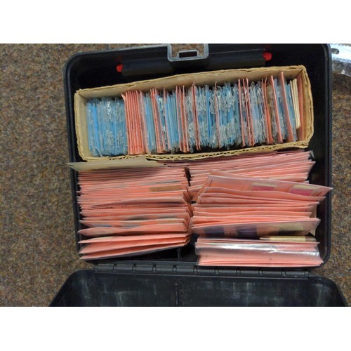 557 - Two boxes of mixed stamps, loose and albums of world stamps. 