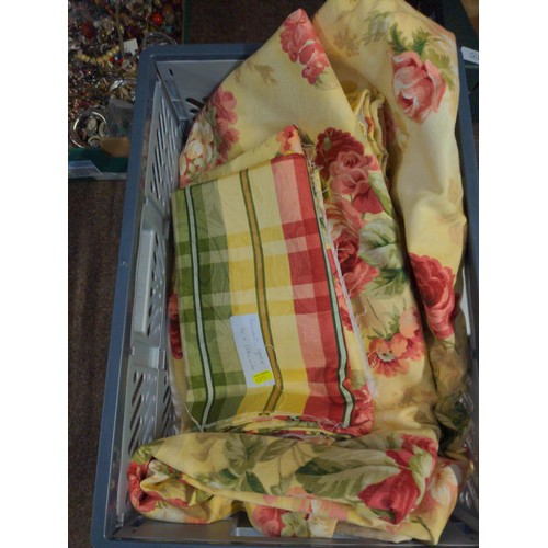 560 - Crate of assorted floral textiles and curtains. inc. cream patio curtains