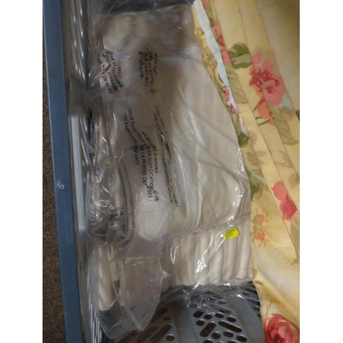 560 - Crate of assorted floral textiles and curtains. inc. cream patio curtains