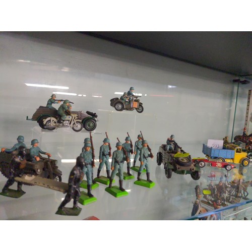 593 - Shelf of mixed toy soldiers, military vehicles inc, Brittans etc 