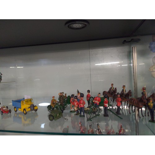 593 - Shelf of mixed toy soldiers, military vehicles inc, Brittans etc 