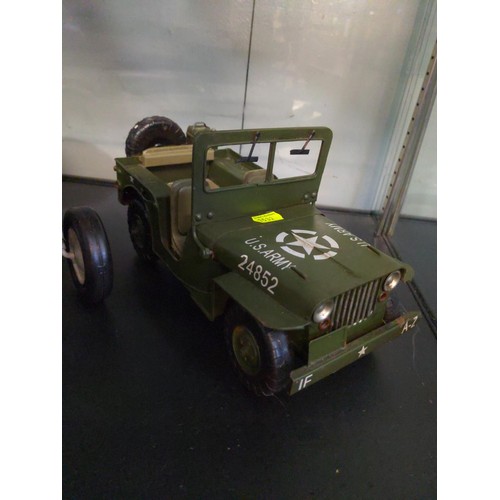 602 - Two toy tractors and a USA army jeep.